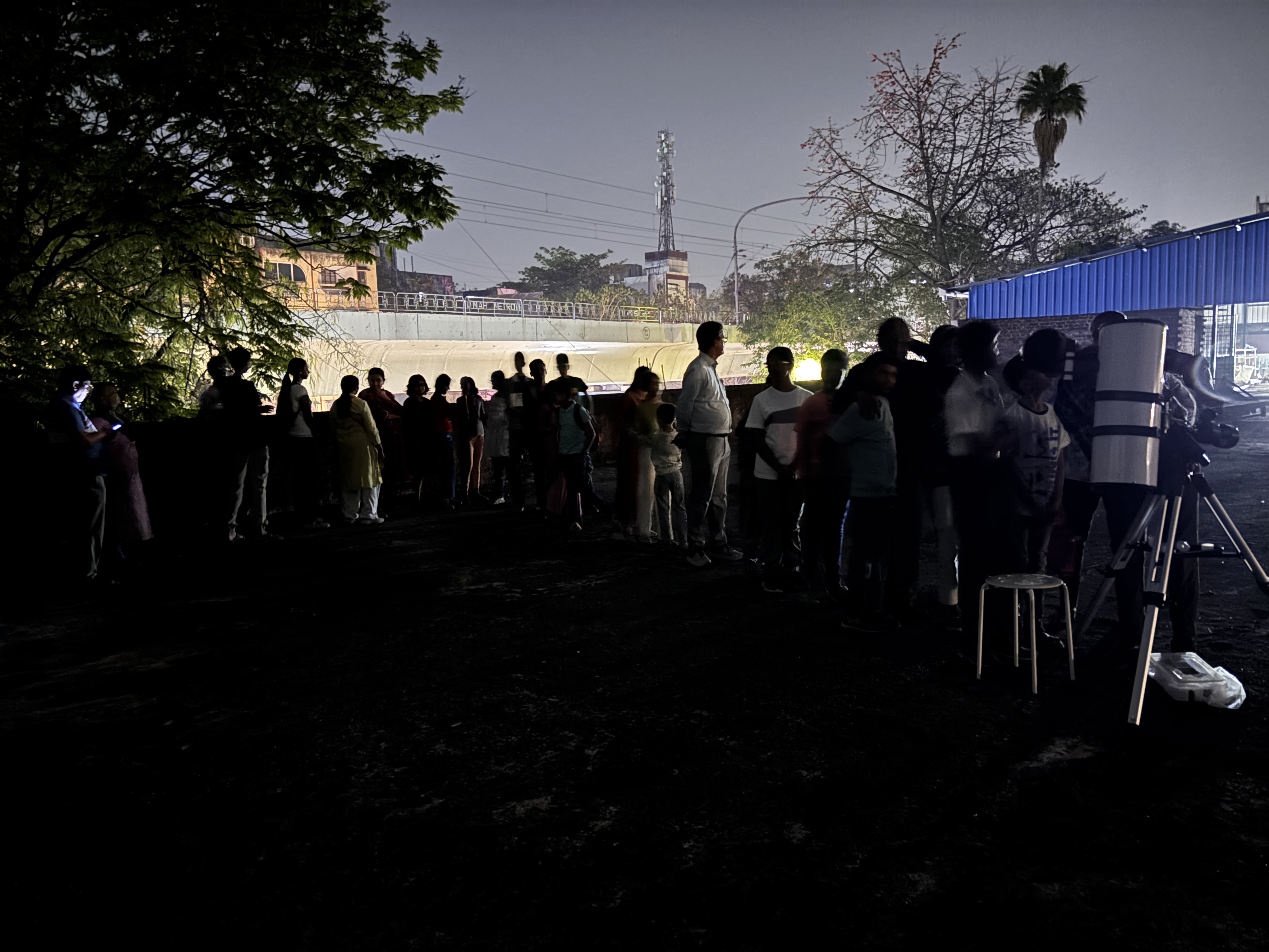 Public stargazing event at night
